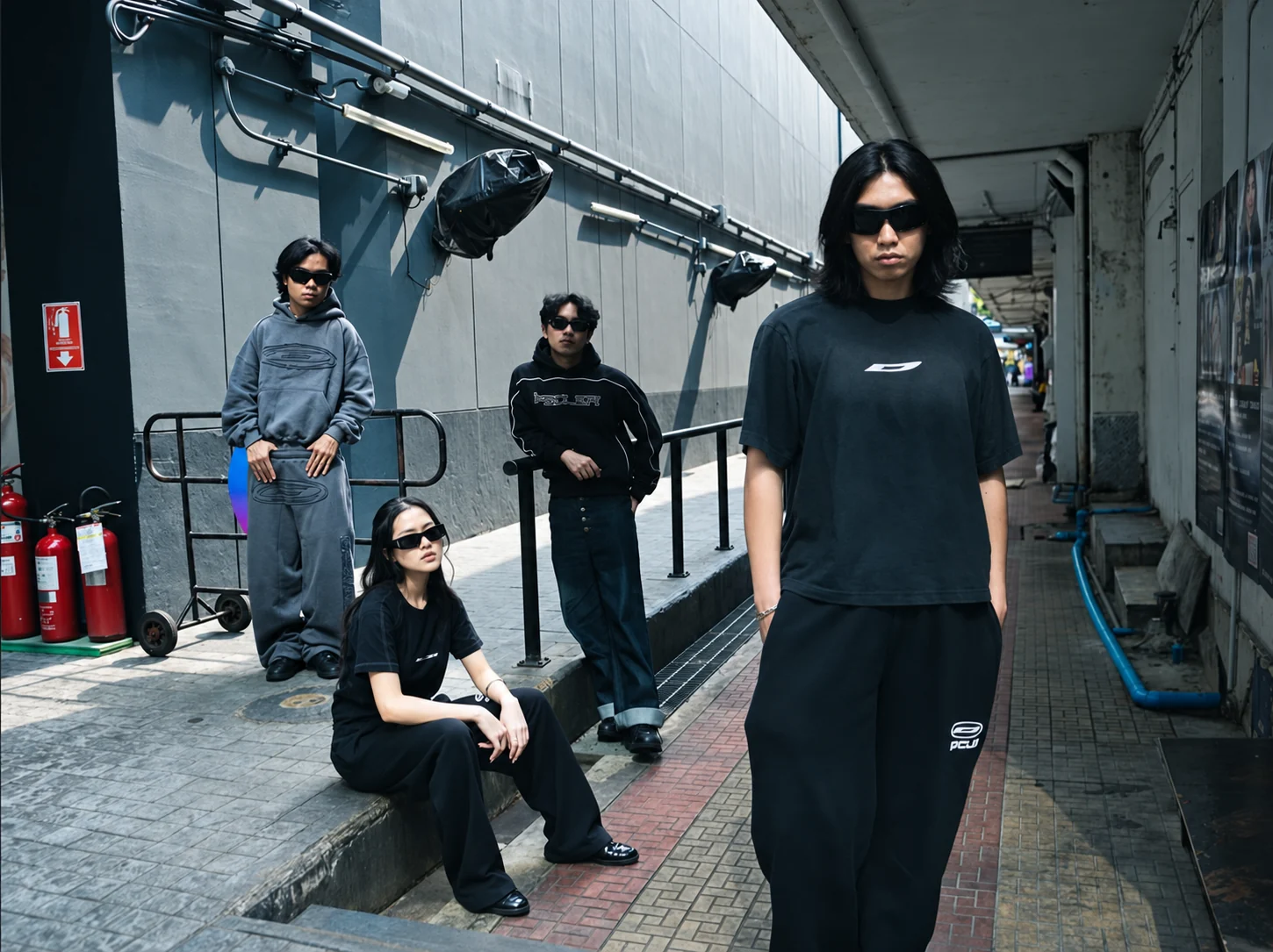 Four people in streetwear outside DISCLOSURE